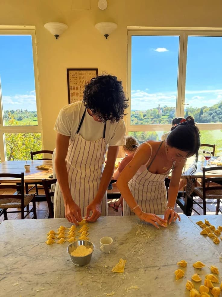 Couple making pasta at a cooking class